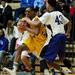 Ypsilanti senior Jalen Harmon is heavily defended by Pioneer in the game on Monday, March 4. Daniel Brenner I AnnArbor.com
